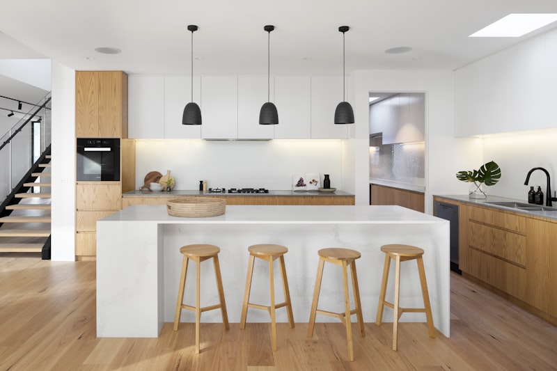 Modern kitchen remodel with island, pendant lights, and new cabinets